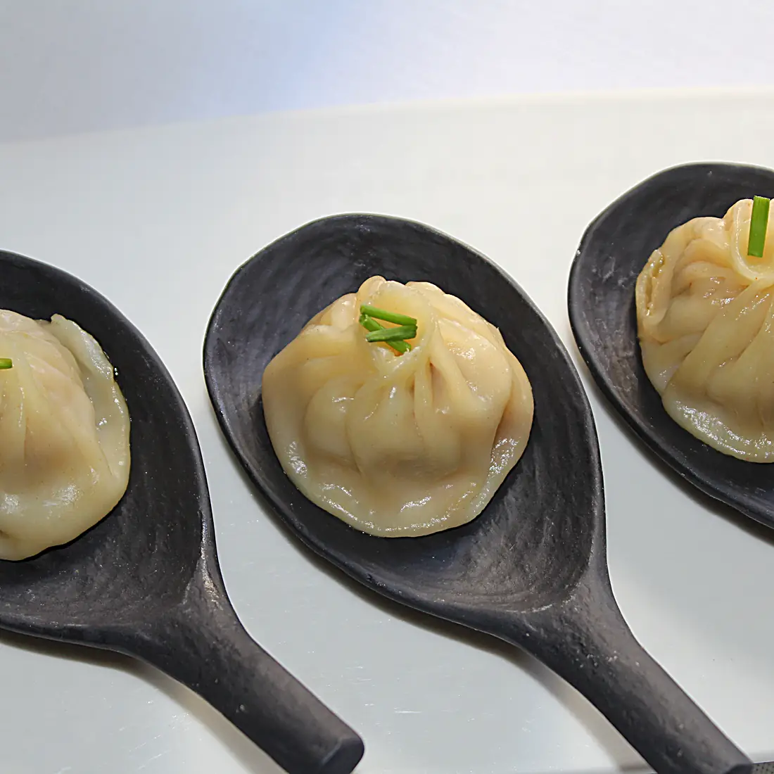 Xiaolongbao ravioli al vapore ripieni di brodo da Tao Modena